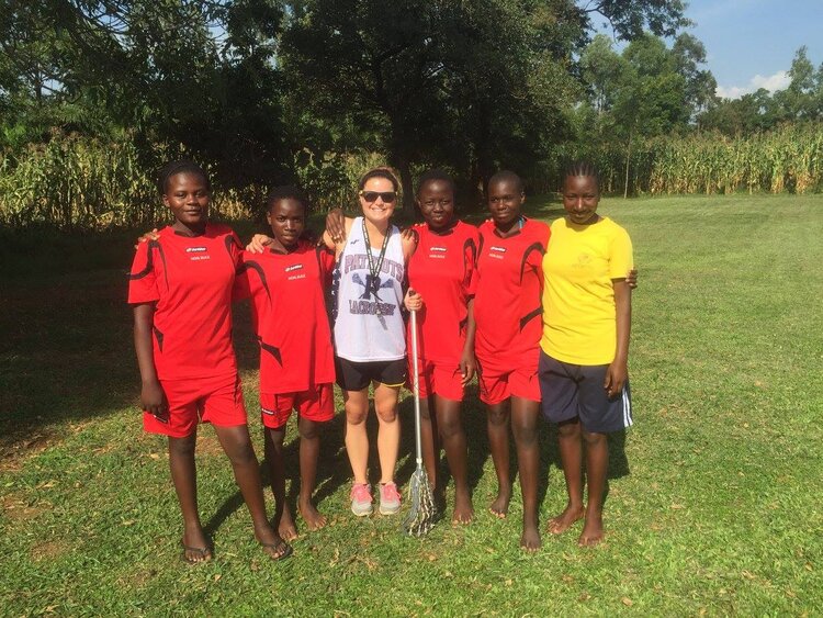 Carly, with players from the Kenya Lacrosse Program.