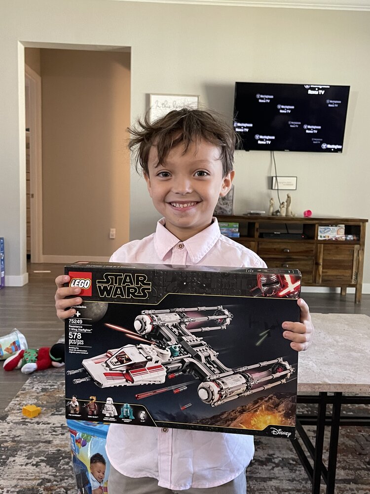 Happy child with lego gift