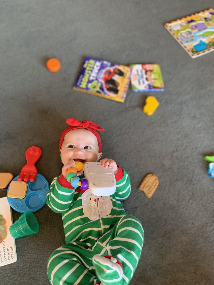 smiling baby with new toy