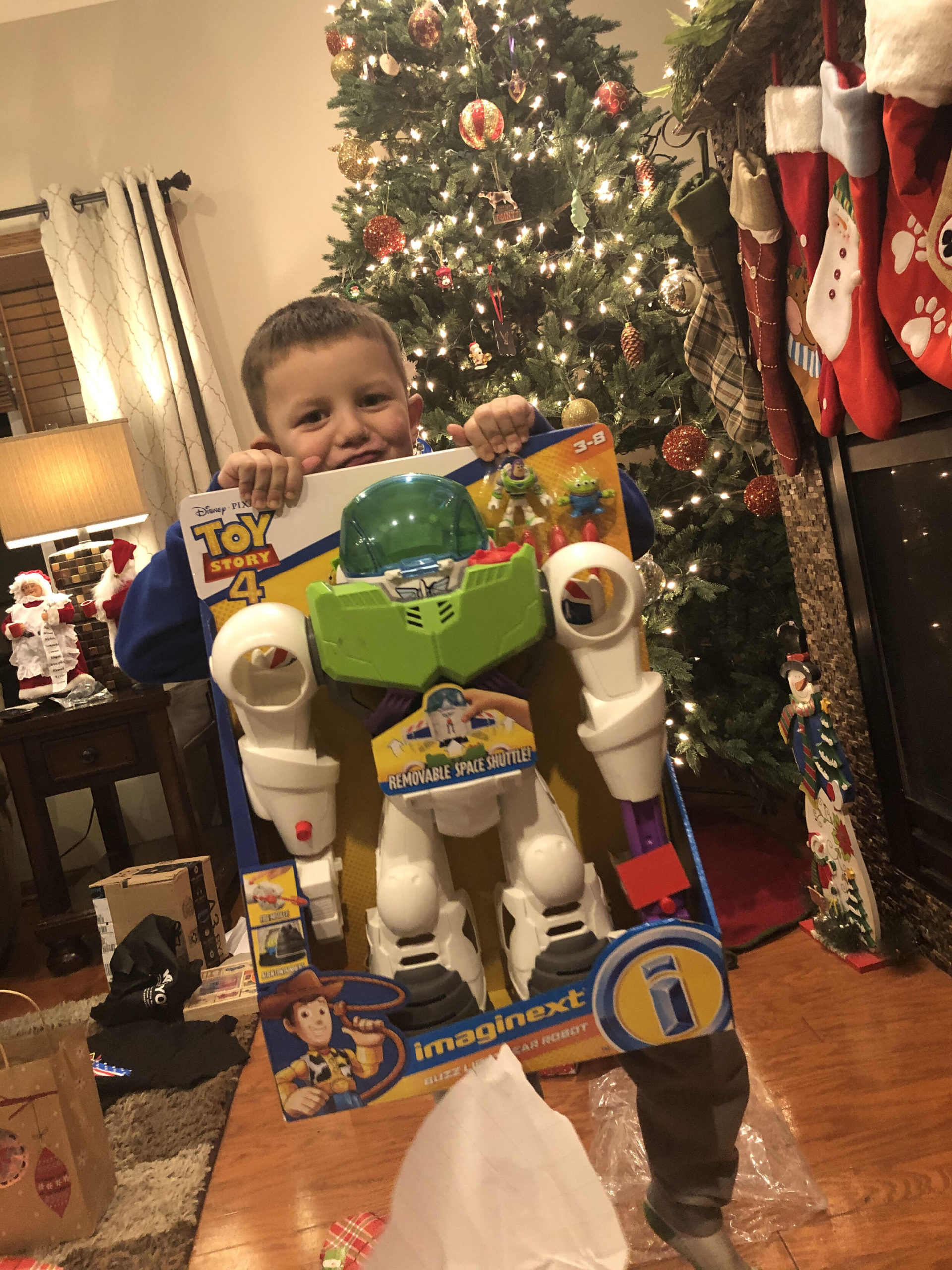 boy with toy story toy
